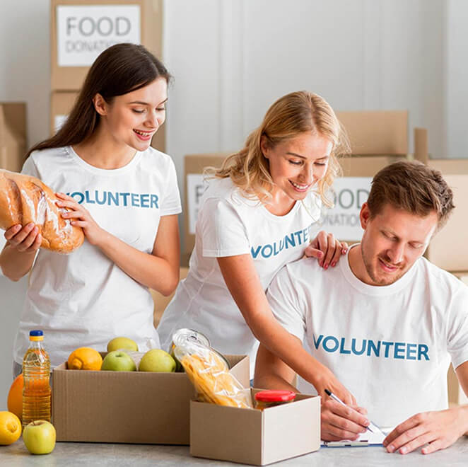 Volunteers packing food donations